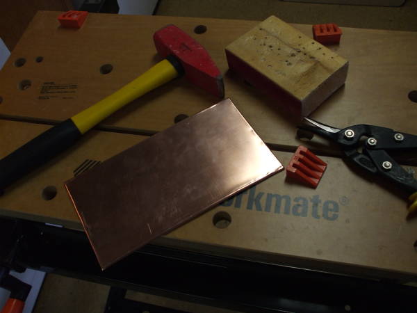 Bending the copper flashing.