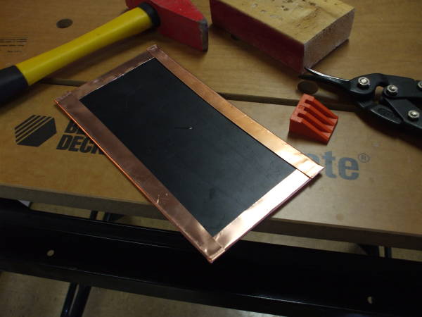 Bending the copper flashing.