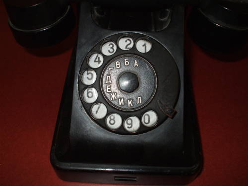 Soviet Багта-50 telephone, close-up view of the rotary dial.  It has the Russian dial code: 1=A, 2=B, 3=V, 4=G, 5=D, 6=E, 7=Zh, 8=I, 9=K, 0=L.