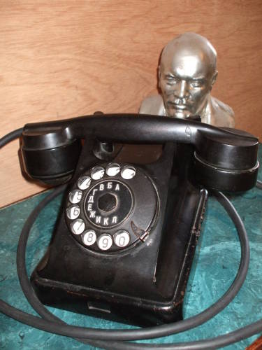 Lenin looks over the Soviet Багта-50 telephone.