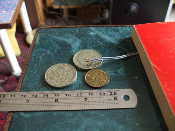 Tiny Litz wires with two Soviet 1-ruble coins and a Moscow Metro token.