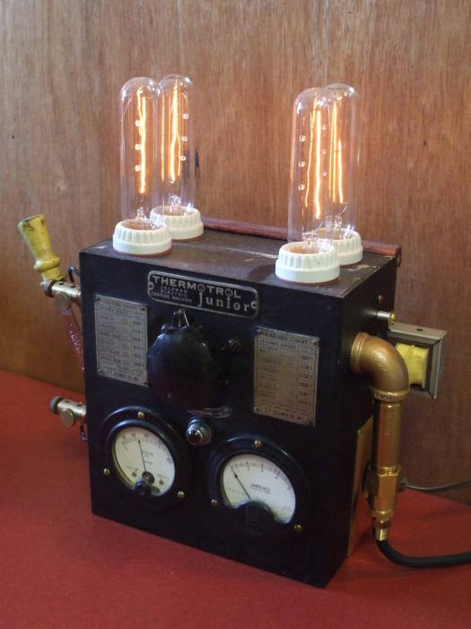 An overly industrial steampunk power controller and lamp.