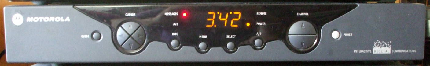 Motorola DCT 2000 digital set-top box for cable television.  Oooh, the messages light is lit!  That means I could look at some on-screen spam urging me to watch the latest wrestling pay-per-view show.