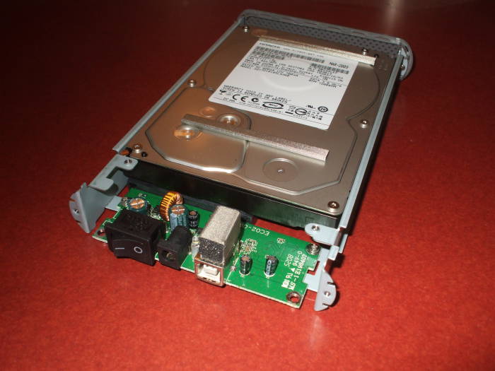 iOmega external disk, disk and USB interface on internal frame, top view.