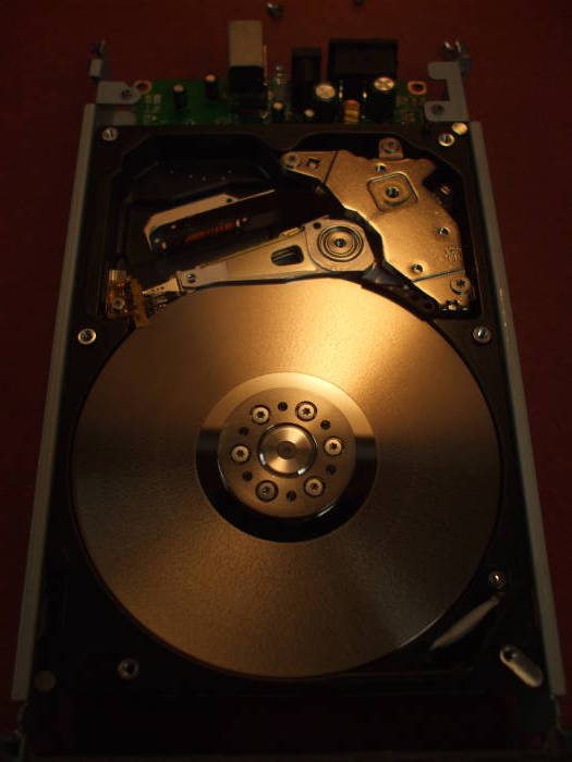 iOmega external disk, cover removed and platters and heads and arms exposed.