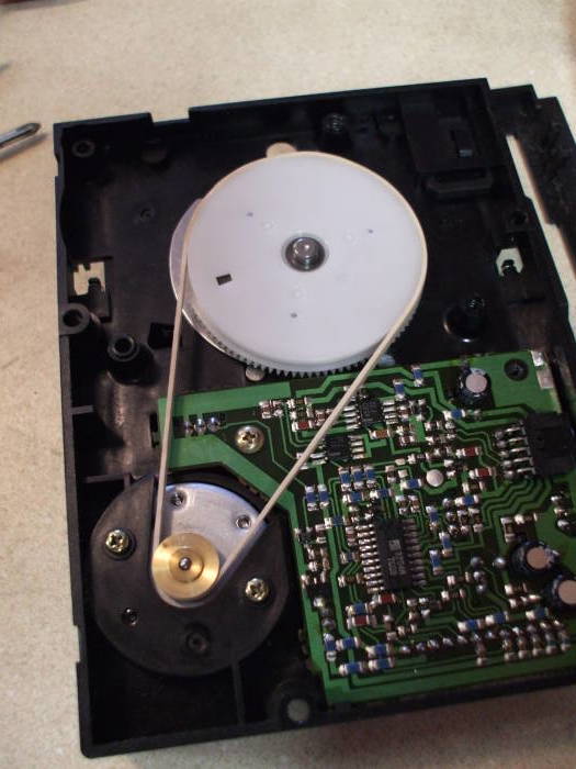 Mitsumi Quick Disk drive with a crude replacement drive belt.