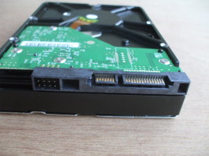 1 TB disk drive with SATA power and data connectors.