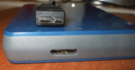 USB-3 cable and connector on a 1 TB external disk drive.