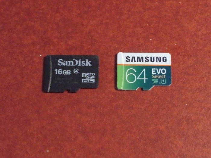 Two flash memory chips: SanDisk 16 GB and 64 GB Samsung.