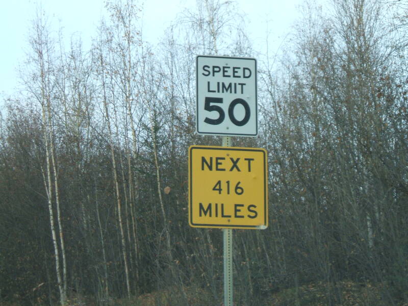 Sign on the Dalton Highway in Alaska: Speed Limit 50 NEXT 416 MILES.
