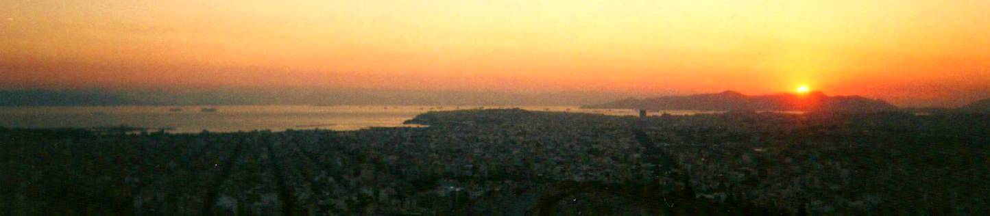 Sunset over Piraeus and the Saronic Gulf as seen from Athens.