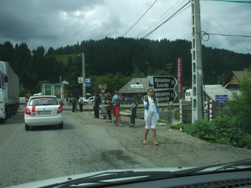 People selling mushrooms and berries along the road in northern Romania.