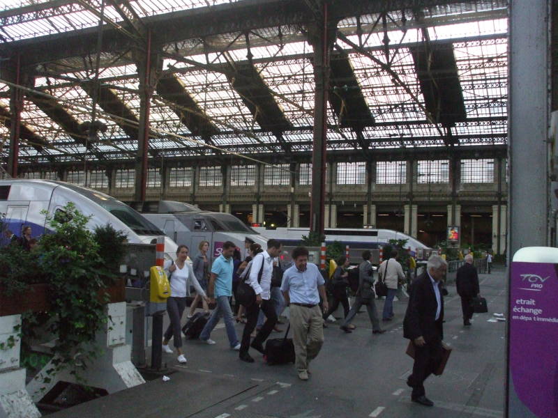 Passengers disembark at a large French train station:  Paris Gare de Lyon.