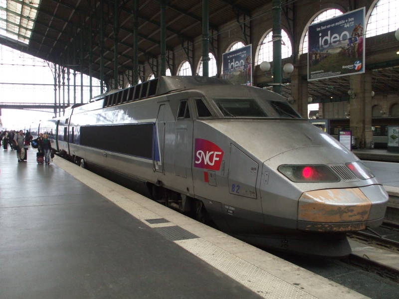 French TGV high-speed train on the platform in Paris Gare du Nord.