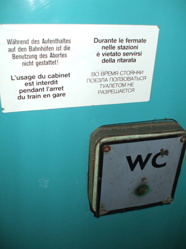 Toilet sign inside a Bulgarian sleeper or pullman passenger car.