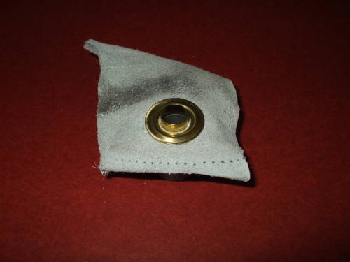 Grommet washer is placed on the grommet body.