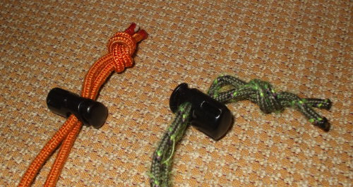 Two new cord locks on colored 3 mm cord.
