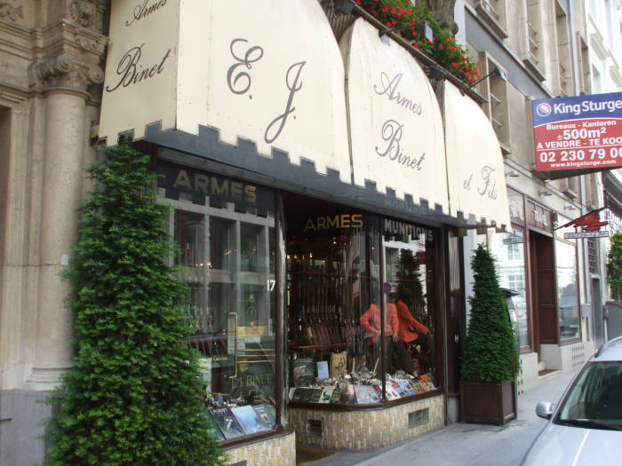 Armes Binet, E.J. Binet et Fils, Art Nouveau architecture and an Belgian arms dealer along the Rue Royale in Brussels.