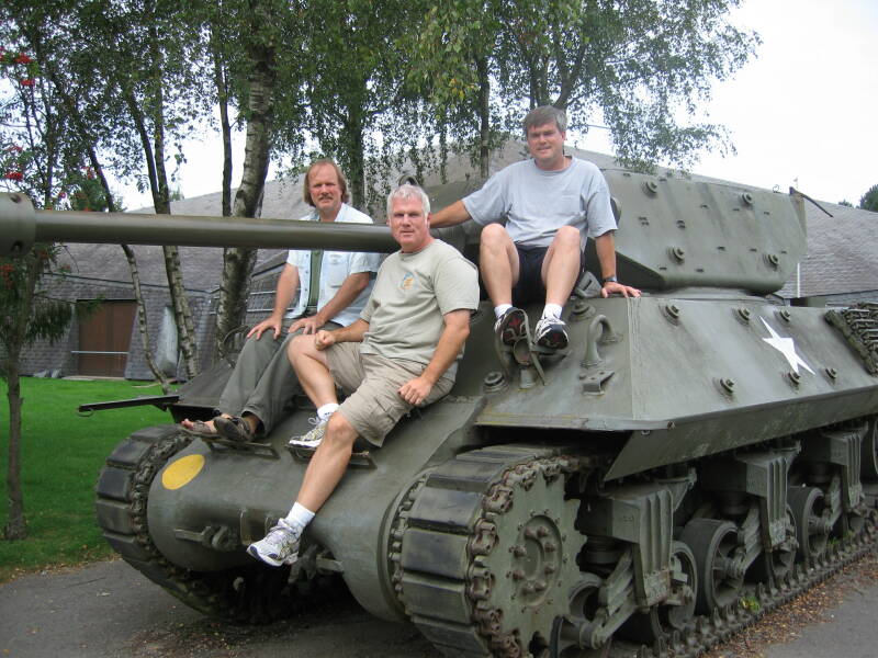 Bob, Jeff and Tim sitting on a tank