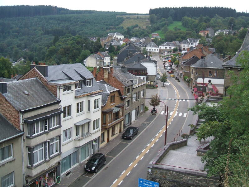 Forested hills and the main road through Houffalize, Belgium.