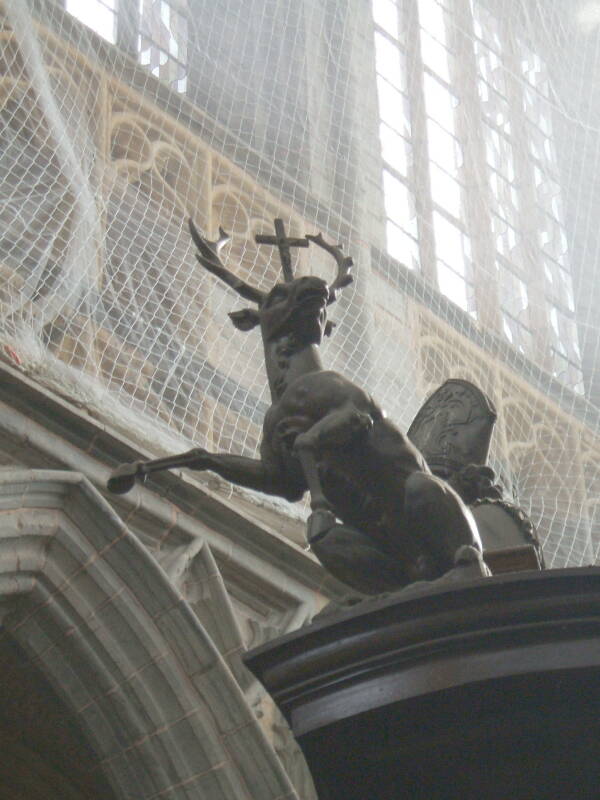 Jägërmëïstër hart statue inside the cathedral at the center of Saint-Hubert, in the Ardennes Forest in Belgium.