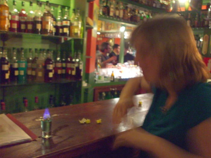 A glass of absinthe with a sugar cube and slotted spoon in the Delirium Tremens absinthe bar in Brussels.