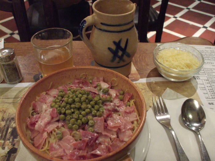 Surreal spaghetti with a pichet of lambic beer in À la Bécasse cafe in Brussels.