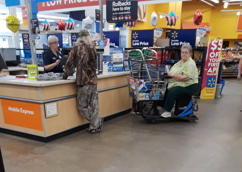 Man wearing 3 camouflage patterns at once.