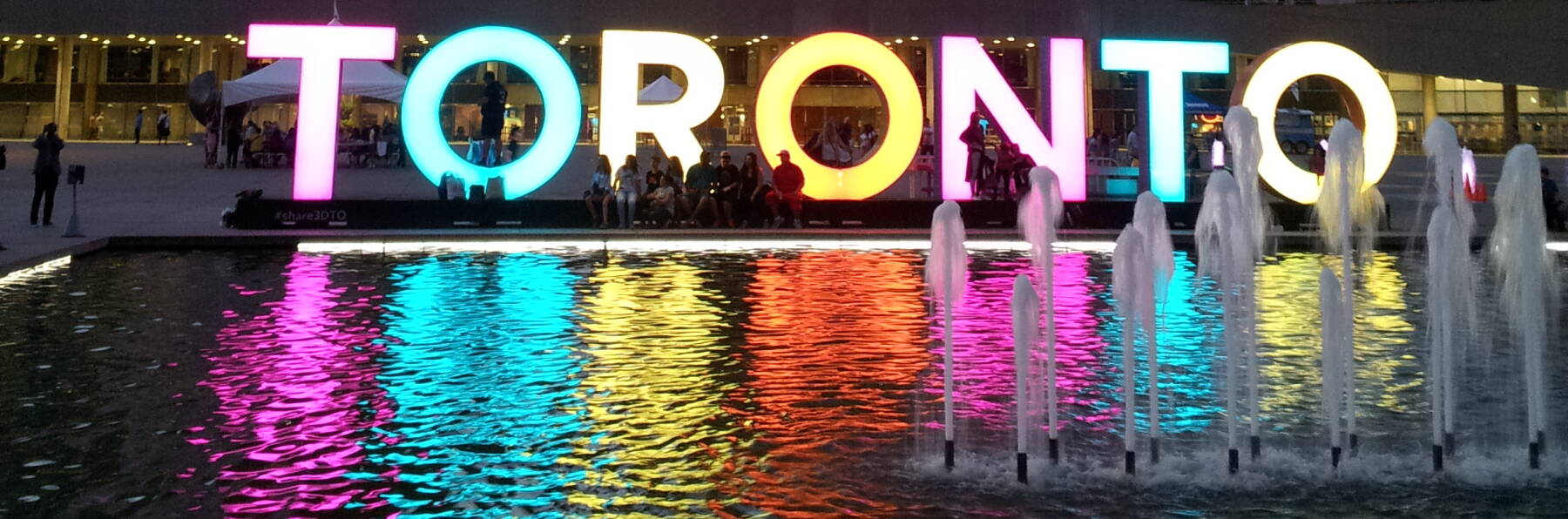 Multi-color sign near the Toronto City Hall.