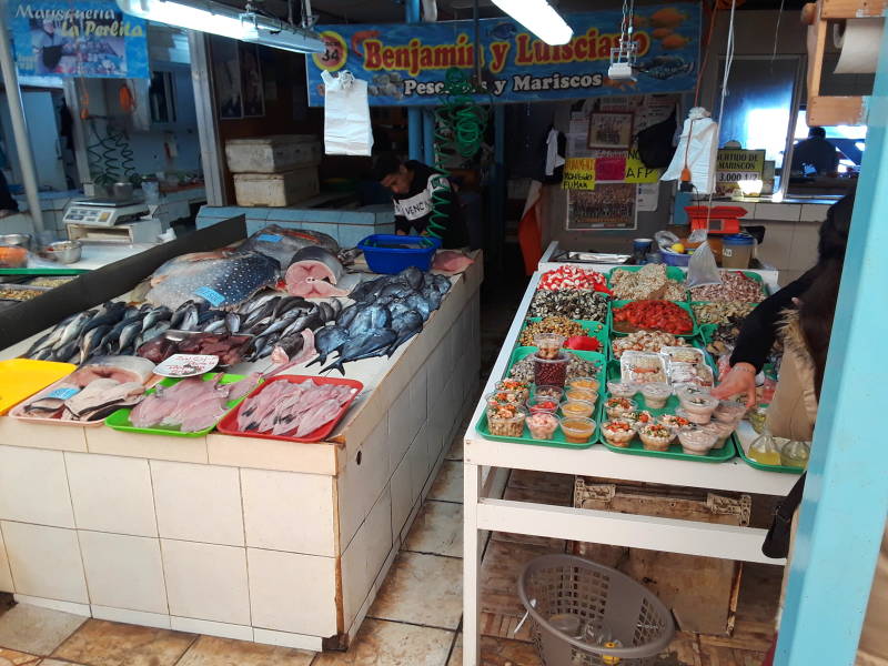 Local people sample food at the seafood market at the waterfront in Coquimbo.