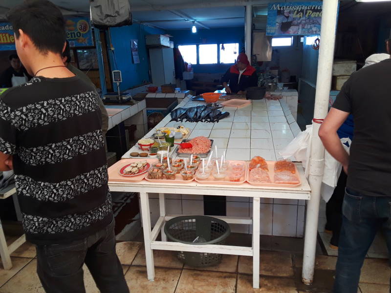 Local people sample food at the seafood market at the waterfront in Coquimbo.