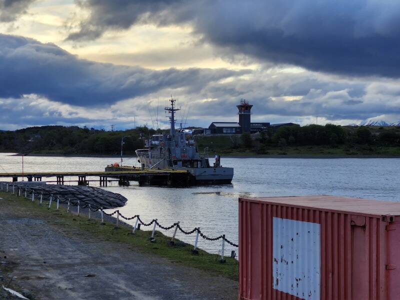 Navy patrol boat with the airport tower in the background.