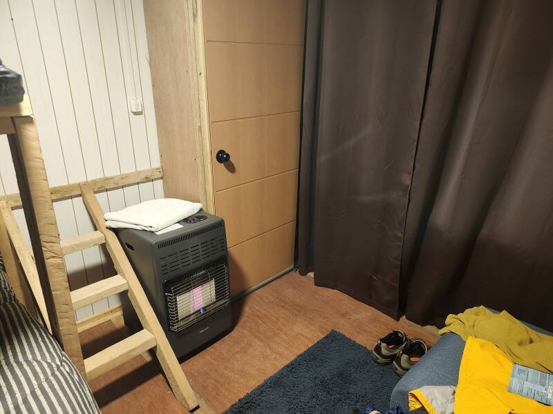 Interior of my room: heater and door out onto the porch.