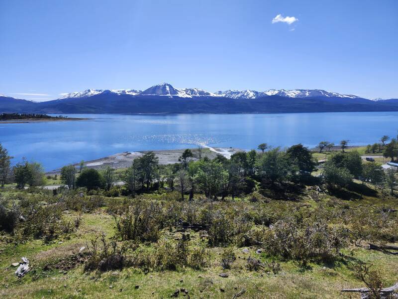 Water from Cascada Los Bronces entering the Beagle Channel in a fan-shaped flow.