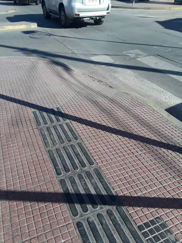 Wandering the neighborhoods of La Serena, Chile; proper low-vision sidewalk markings.