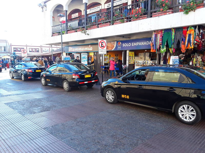 Taxis and shared taxis at Mercado La Recova in La Serena, Chile.