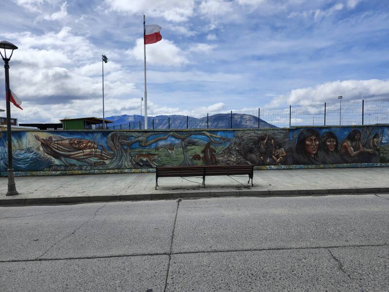 Mural showing smilodon, mylodon, and indigenous peoples.