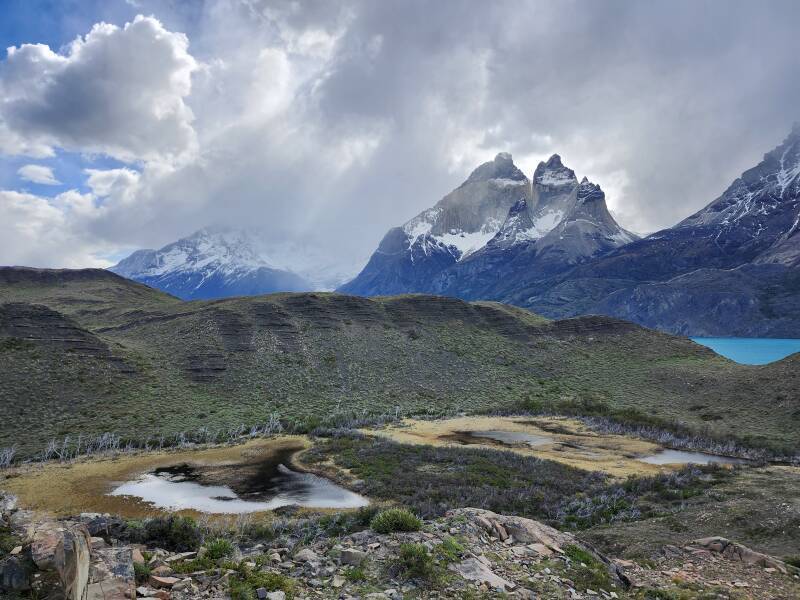 Wispy tendrils of clouds swirling around Cuernos del Paine.