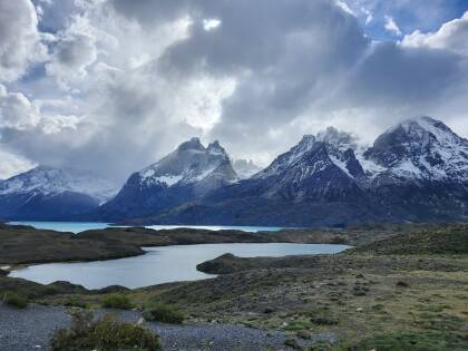 Torres del Paine in dramatic sunlight and clouds.