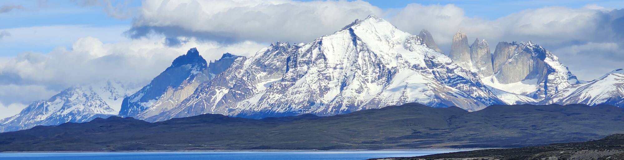 Left to right: Cuerno Paine Grande, Cuernos del Paine, Monte Almirante Nieto, Torre del Paine Sur, Torre del Paine Central, Torre del Paine Norte, and Cerro Nido de Condor.