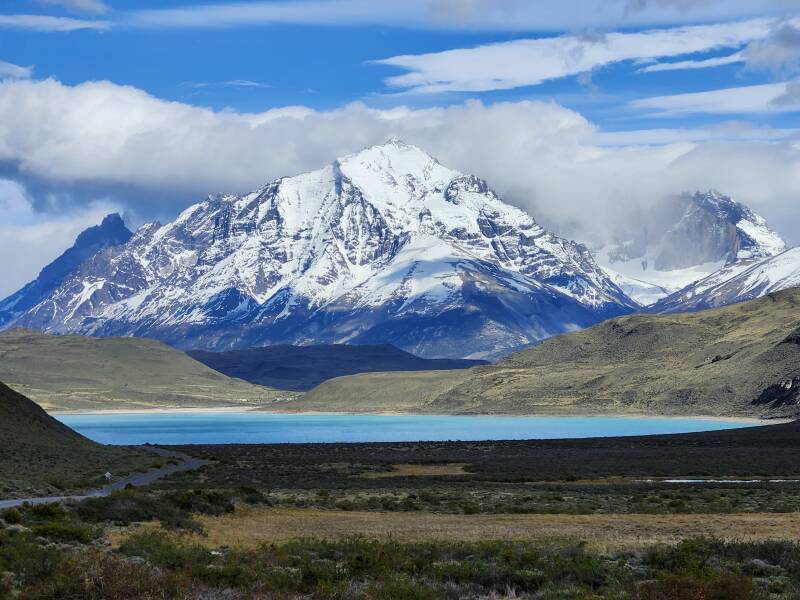 Moved to new viewpoint overlooking Lago Amarga.  Left to right: Cuernos del Paine, Monte Almirante Nieto.  Clouds obscuring Torre del Paine Sur, Torre del Paine Central, Torre del Paine Norte, and Cerro Nido de Condor.  3× digital zoom.