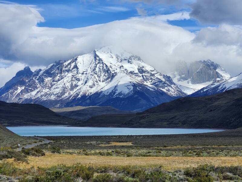 Lenticular clouds over Cuernos del Paine, Monte Almirante Nieto. Clouds obscuring Torre del Paine Sur, Torre del Paine Central, Torre del Paine Norte, and Cerro Nido de Condor.  3× digital zoom.