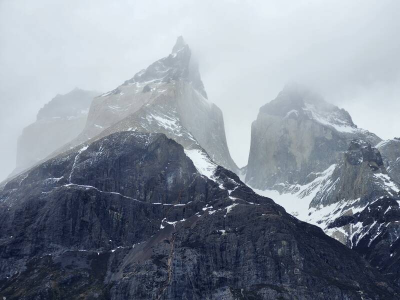 Peaks of Cuernos del Paine in the clouds.