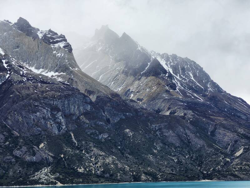 Peaks of Cuernos del Paine in the clouds.