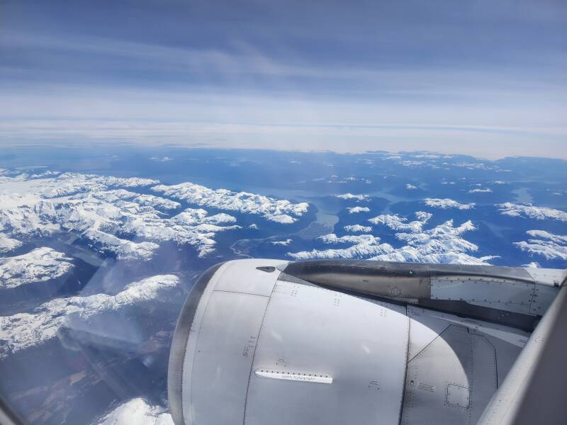 Ranges of snow-covered mountains with glaciers in some valleys.