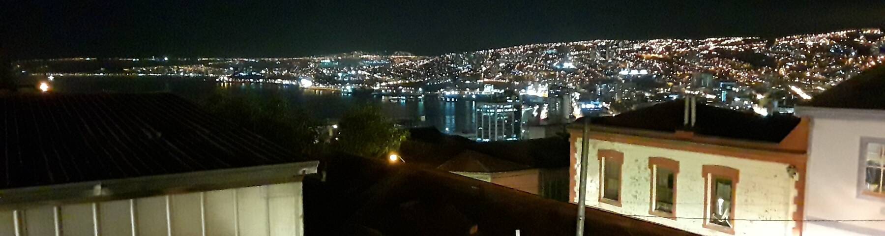 Harbor and hills of Valparaíso at night.