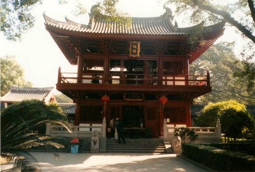 Two-story white and red Buddhist temple in China.