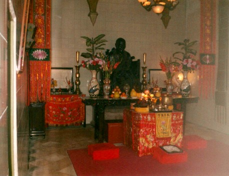 Buddhist shrine altar with fruit offerings.