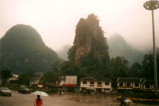 Stone towers, karst formations above the markets in central Yangshuo, China.