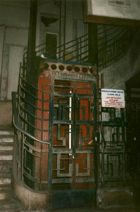 Old open cage elevator in an apartment building in Cairo.